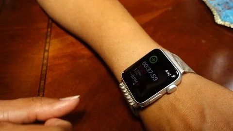Checking heart rate on Apple watch Stock Footage 96005511
