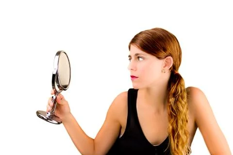 Checking herself in the mirror Stock Photos