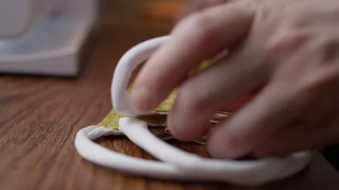 Checking homemade face masks slow motion Stock Footage 128380636