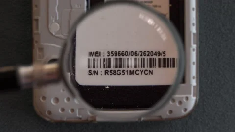 Checking imei number code smart phone mobile magnifying glass 스톡 동영상 202162716