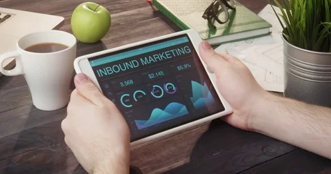 Checking inbound marketing records using digital tablet at desk Stock Footage 80698927