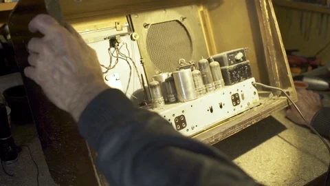 Checking inside of an old radio. Stock Footage 124653084