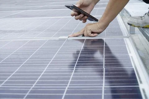 Checking the installation of solar panels. Stock Photos