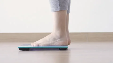 Checking kilogrammes getting on the scale Stock-Footage 268060271