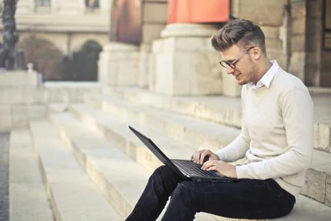 Checking laptop on the street Stock Photos