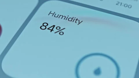 Checking the level of humidity on smartphone app Stock Footage 302714279