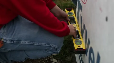Checking level outside on wall Stock-Footage 10590280