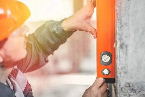 Checking the level of vertical columns of a reinforced concrete frame Stock Photos