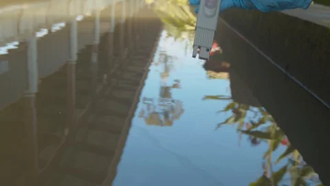 Checking the local water supply with a digital TDS and PH meter - isolated Stock Footage 123746989