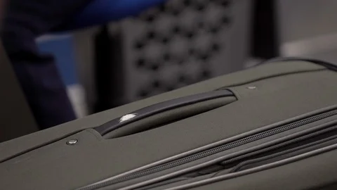 Checking luggage suitcase of passengers on border in airport. check-in on board Stock Footage 98602998
