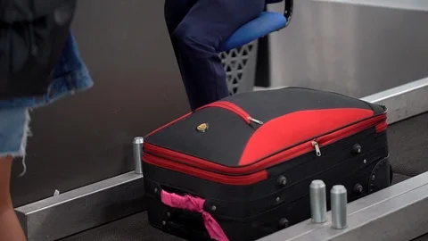 Checking luggage suitcase of passengers on border in airport. check-in on board Stock Footage 98603137