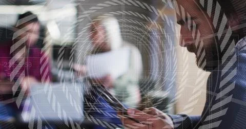 Checking man in blazer tapping smartphone in coworking office, with digital Stock Photos