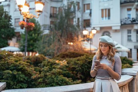 Checking a map on her phone Stock Photos