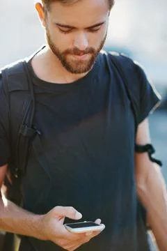 Checking the map on his phone Stock Photos