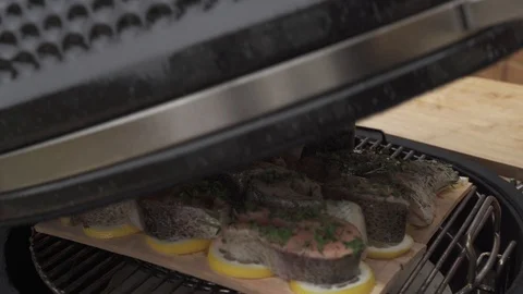 Checking on marinated chunks of salmon grilling Stock Footage 111513041