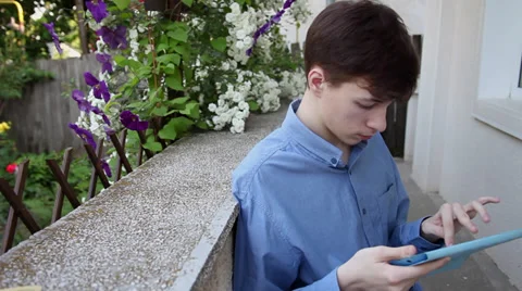 Checking messages, internet, mail, tablet computer, outdoors Video stock 39654393