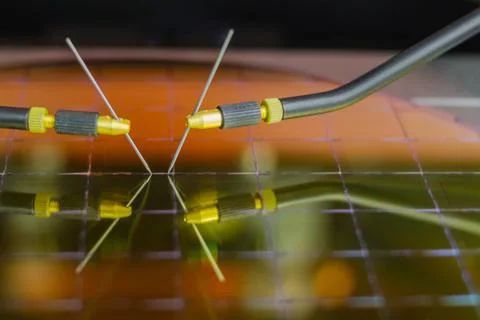 Checking microchips on silicon wafer with probe station.Microelecronics. Stock Photos