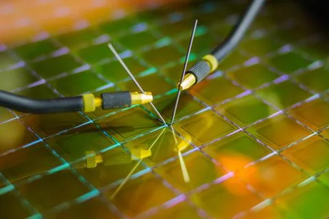 Checking microchips on silicon wafer with probe station.Microelecronics. Stock Photos
