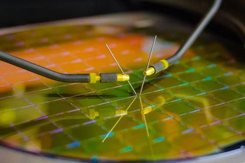 Checking microchips on silicon wafer with probe station.Microelecronics. Stock Photos