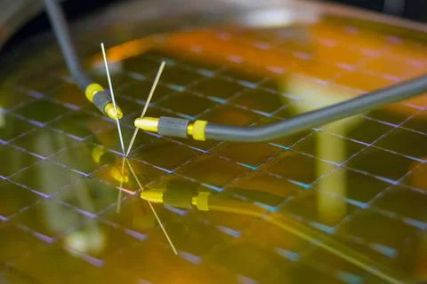 Checking microchips on silicon wafer with probe station.Microelecronics. Stock Photos