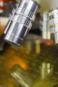 Checking microchips on silicon wafer with probe station and microscope.Microe Stock Photos