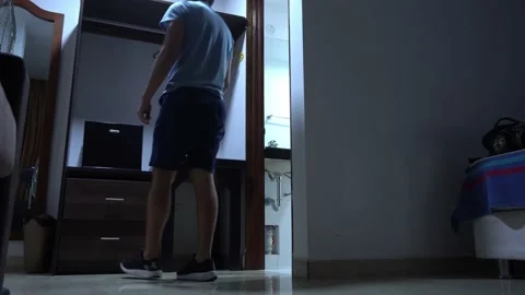 Checking the mini fridge of a hotel Stock Footage 196732753