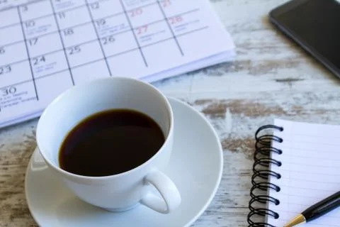 Checking monthly activities in the calendar. Foto stock