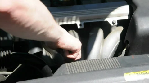 Checking the motor oil on a car Stock Footage 486225