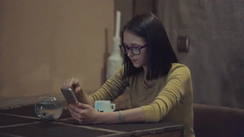 Checking newsfeed on her social network accounts. Pretty girl surfing interne Video stock 95948856