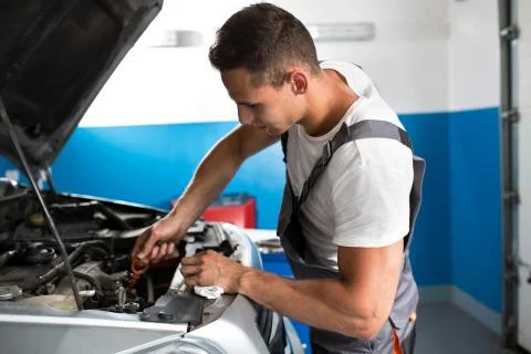 Checking oil in car Foto stock