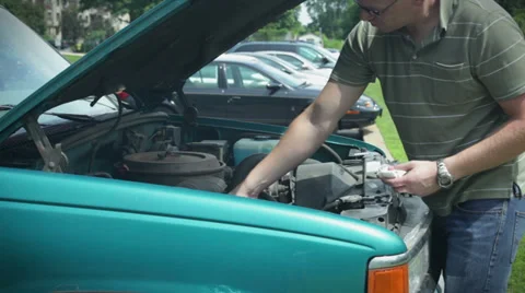 Checking oil Video stock 33309189