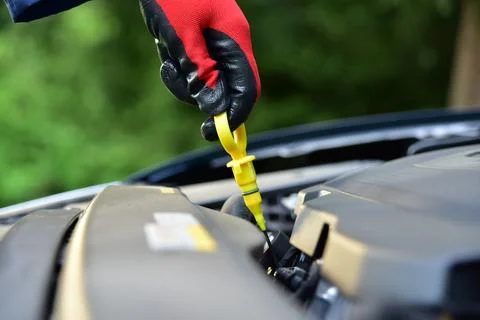 Checking the oil level in the car engine Stock Photos