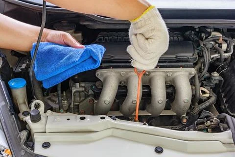 Checking the oil level in a car engine, Selective focus Stock Photos
