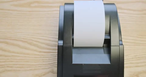 Checking the operation of the thermal receipt printer. A white roll of paper Video stock 219458779