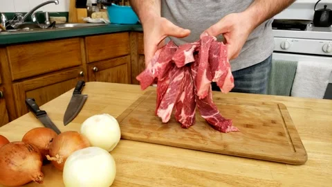 Checking or showing just portioned slices or pieces of raw beef 스톡 동영상 163551513