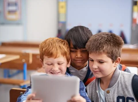Checking out apps together. Cropped shot of elementary school children using a 스톡 사진