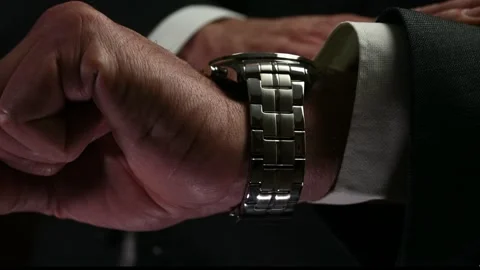 Checking out the time Stock Footage 168584095