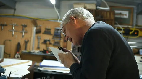 Checking page with magnifier Stock Footage 590834