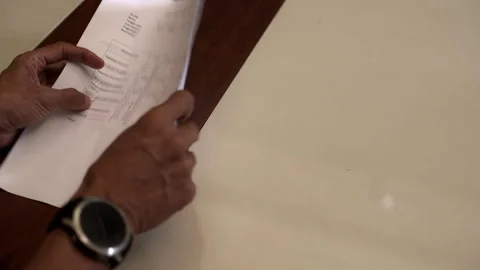 Checking paper document and making payment with US dollar Stock Footage 337268960