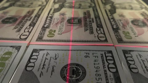 Checking paper dollars with a laser scanner as a means of financial transactions Video stock 138985467