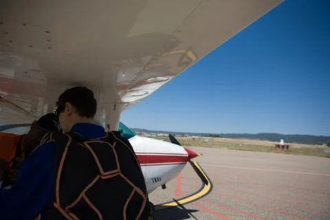 Checking the parachute before boarding Stock Photos