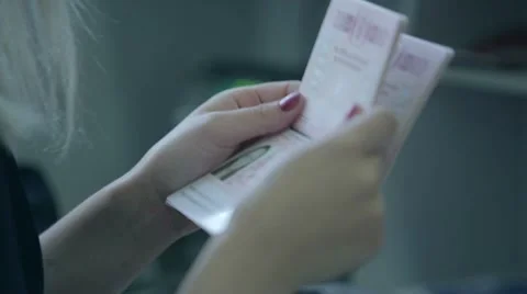 Checking passports at the airport check in Stock Footage