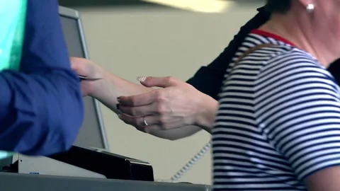 Checking passports and boarding cards at airport terminal. 4K video Stock Footage 76143340