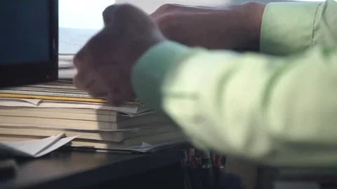 Checking pile of paper in the office Stock Footage 71730294