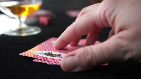 Checking playing cards with winning combination on the black table, poker game Stock Footage 133156348