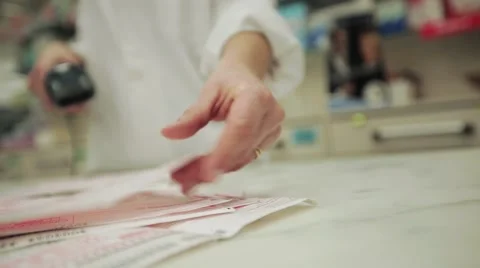 Checking prescriptions medicines barcode at the pharmacy Stock Footage 46990018