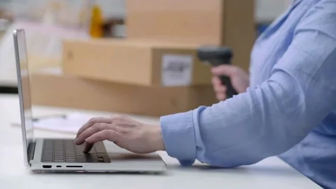 Checking product barcodes before delivery SME business, closeup laptop hand Stock Footage 238862466
