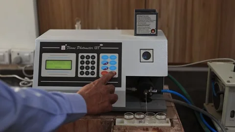 Checking production quality in laboratory export flame photometer machine Video stock 250539028