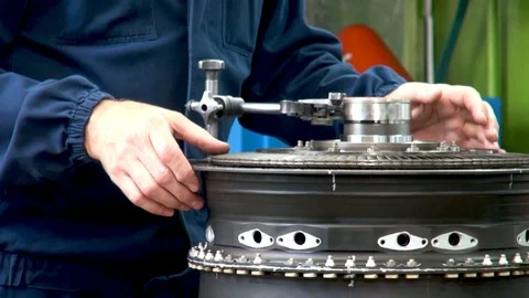 Checking quality of assembly of rotor in housing of aircraft engine TV3-117. Stock-Footage 123210069