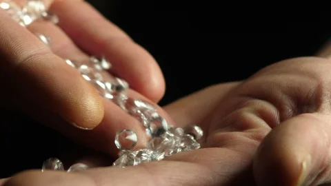 Checking quality of bunch of cubic zirconia crystals Stock Footage 88889099